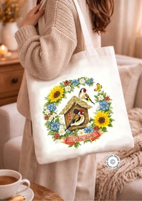 Modèle point de croix L'abri doré brodé sur un tote bag Création Annick Abrial
